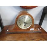 A mahogany inlaid mantel clock with key