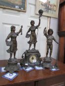 A 3 piece clock garniture surmounted figures with a fishing theme