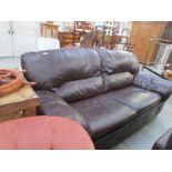 A dark brown leather sofa