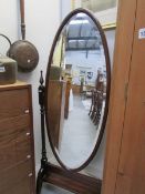 A bevel edged cheval mirror