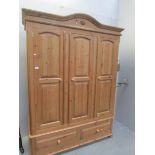 A 3 door pine wardrobe