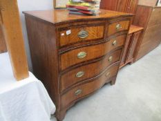 A Georgian serpentine front 2 over 3 chest of drawers