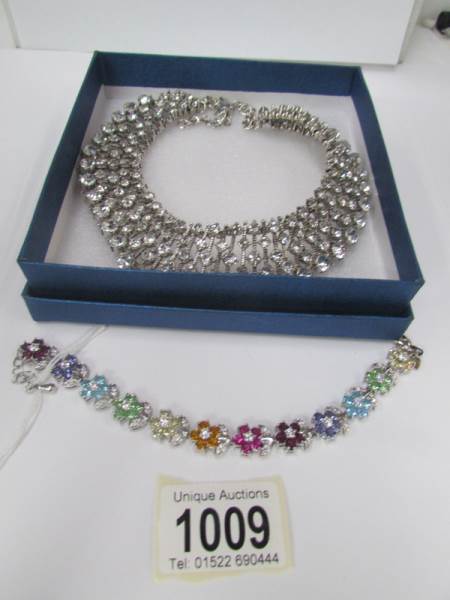 A rhinestone jewelled collar necklace and a multi coloured crystal bracelet
