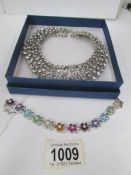 A rhinestone jewelled collar necklace and a multi coloured crystal bracelet