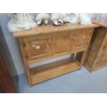 A solid pippy oak 2 door console table