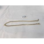 A 9ct gold neck chain. 19.