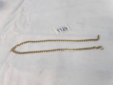 A 9ct gold neck chain. 19.