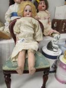 A porcelain headed doll with kid body marked 370 AM 2/OX DEP, Armand Marseille,