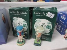A Royal Doulton Penfold golfer and Dunlop caddy figures (boxed with certificates)