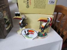 A Royal Doulton Guinness seaside and Christmas seaside figures (boxed with certificate) together