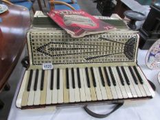 A cased Septimmio Soprani piano accordion