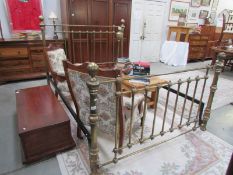 A Victorian style king size brass bedstead
