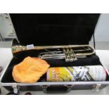 A cased Blessing USA trumpet