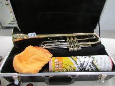 A cased Blessing USA trumpet
