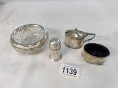 A silver 3 piece condiment set and a silver rimmed bowl