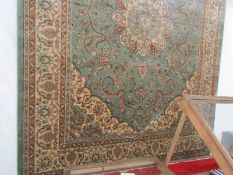 A Keshan green ground carpet, 2.