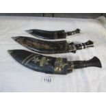 3 kukris with scabbards and skinning knives