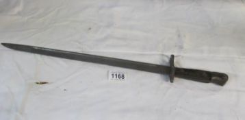 A Remington bayonet (markings mostly worn)