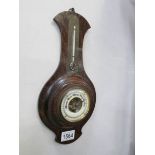 An Edwardian oak barometer with mercury snail thermometer