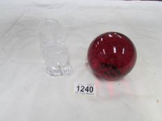 A ruby glass paperweight and a glass owl paperweight