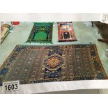 3 prayer mats in various patterns