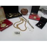 A quantity of yellow metal jewellery including necklaces, bracelet, a pair of earrings,