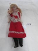 A German doll with porcelain head marked 'Made in Germany H 5/10'