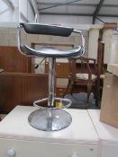 A chrome bar stool