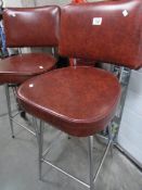 A pair of chrome kitchen stools