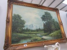An oil on canvas of mountain and forest signed McCalne