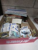 A box of tea and cigarette cards