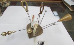 A hat pin stand with hatpins