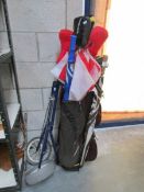 A golf bag, trolley,