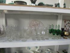 A shelf of glass ware