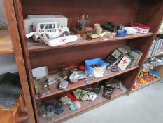 3 shelves of medical items including pharmacy and surgery