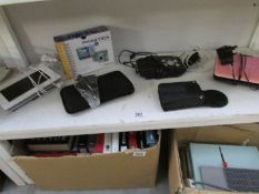 A Praktica camera, a Levro II ebook reader, a digital photo frame, radio,
