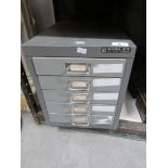 A set of metal filing drawers