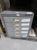 A set of metal filing drawers