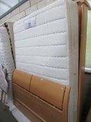 A 4'6" Sealy divan bed,