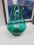 A large green glass vase