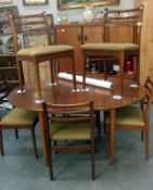 A teak dining table and 6 chairs
