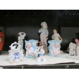 A Coalport figurine, A bisque Cavalier figure, A bisque farm girl, a musical character jug,