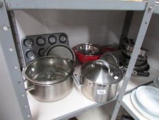 A quantity of stainless steel pans and other kitchenware