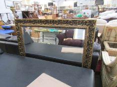 A large gilt framed mirror