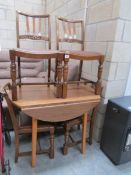 A formica top table and 4 chairs