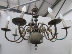 A large 8 lamp brass ceiling light