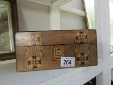 A mahogany inlaid jewellery box