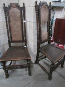 A pair of antique oak hall chairs