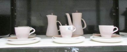 21 pieces of Poole pottery including coffee pots