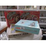 A Merit microscope set and 3 vintage jigsaw puzzles